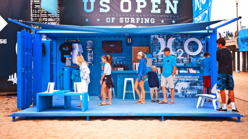 A striking and innovative Hurley booth at the US Open of Surfing, created from a converted cargo container, exemplifying its versatility for event spaces.