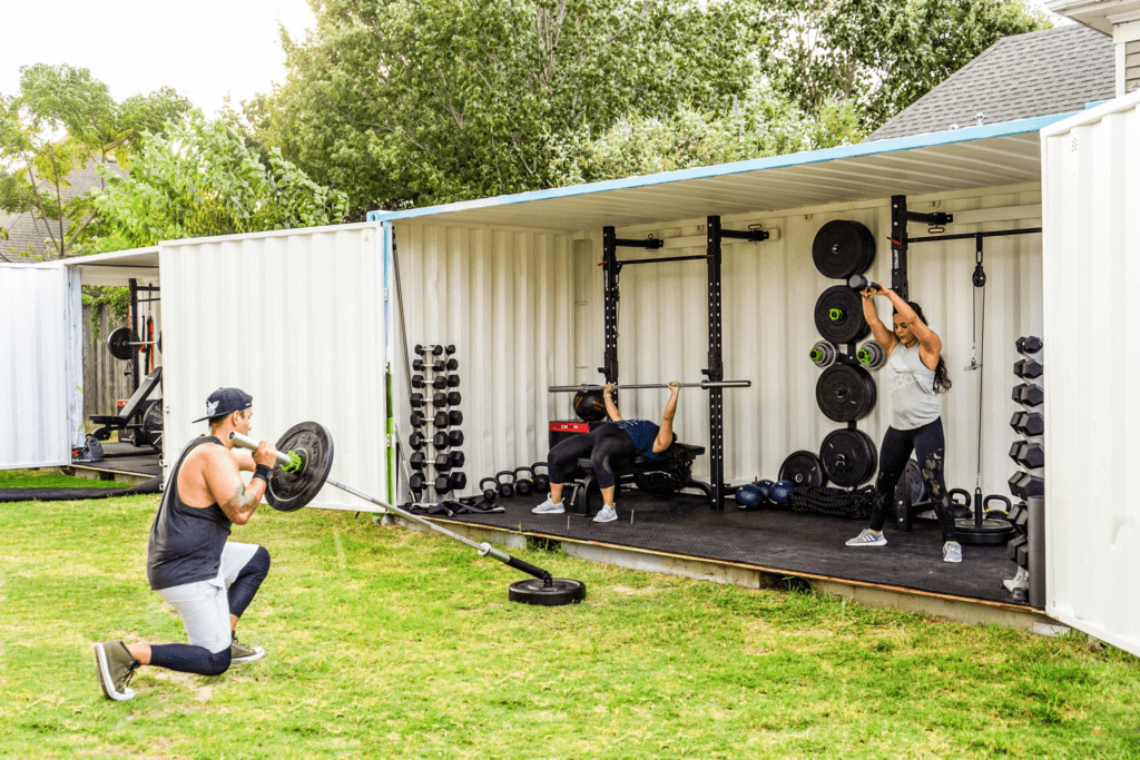 A compact and well-equipped weight room established inside a cargo container, demonstrating its potential for unique fitness center solutions.